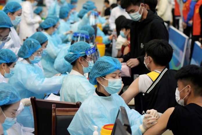 china-vacunacion-covid-coronavirus-reuters-jun-2021.jpg_1612941218 wang yi-china-vacunas