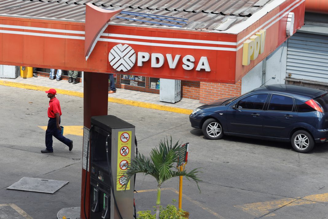 The corporate logo of the state oil company PDVSA is seen at a gas station in Caracas
